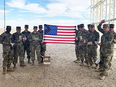 Soldiers holding American Flag